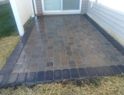 Paver patio with the mustard k pattern in the flagstone color with a charcoal outline paver